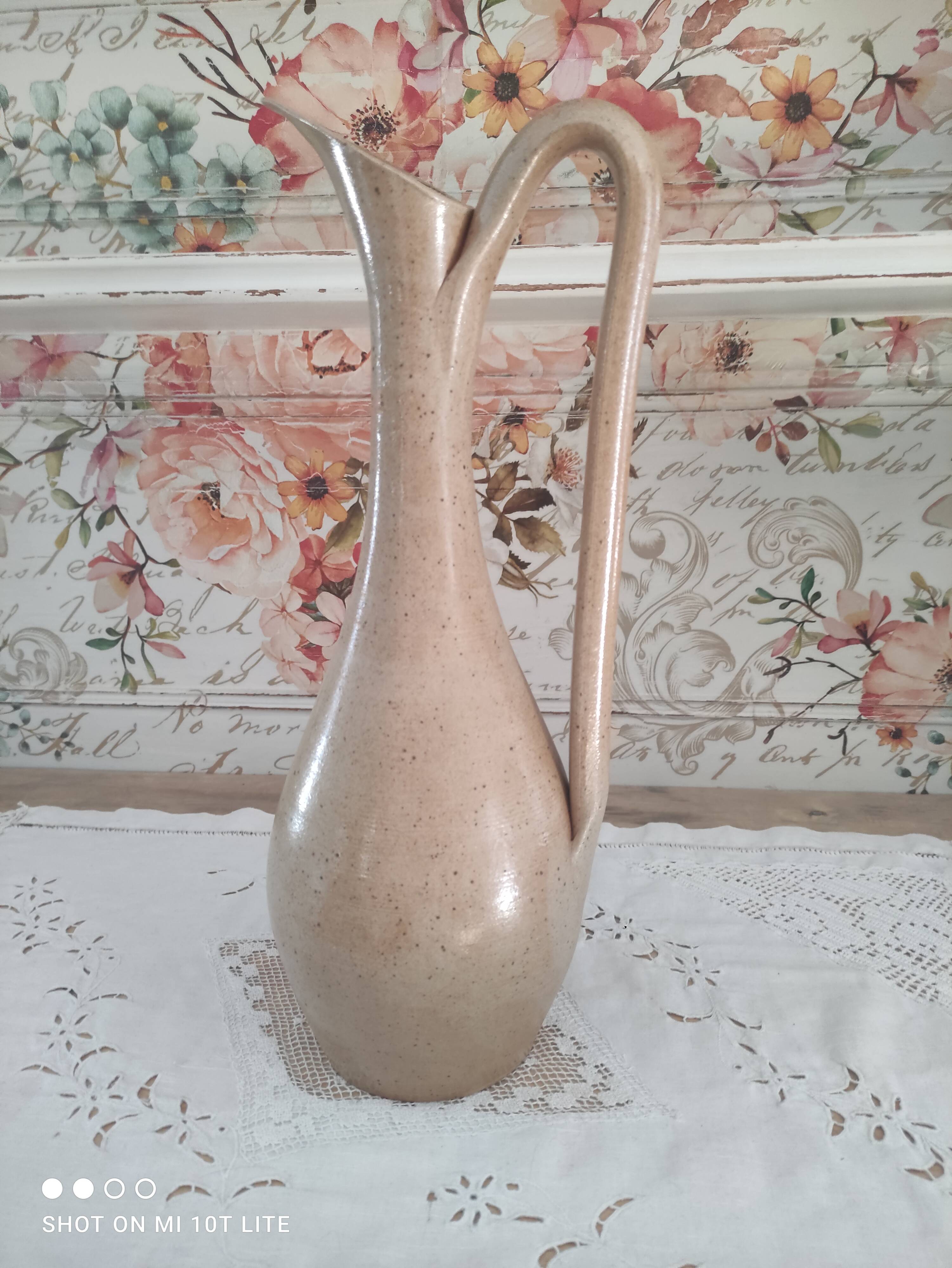 Vintage pitcher in light brown sandstone speckled