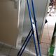 Adjustable mirror on vintage blue tubular structure stand