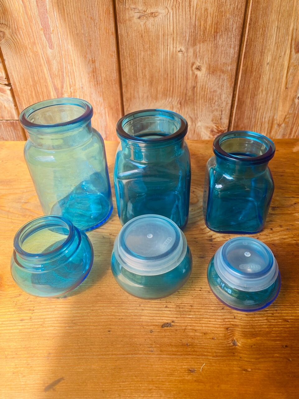 Trio of jars apothecary bottle in blue glass with round cap