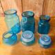 Trio of jars apothecary bottle in blue glass with round cap