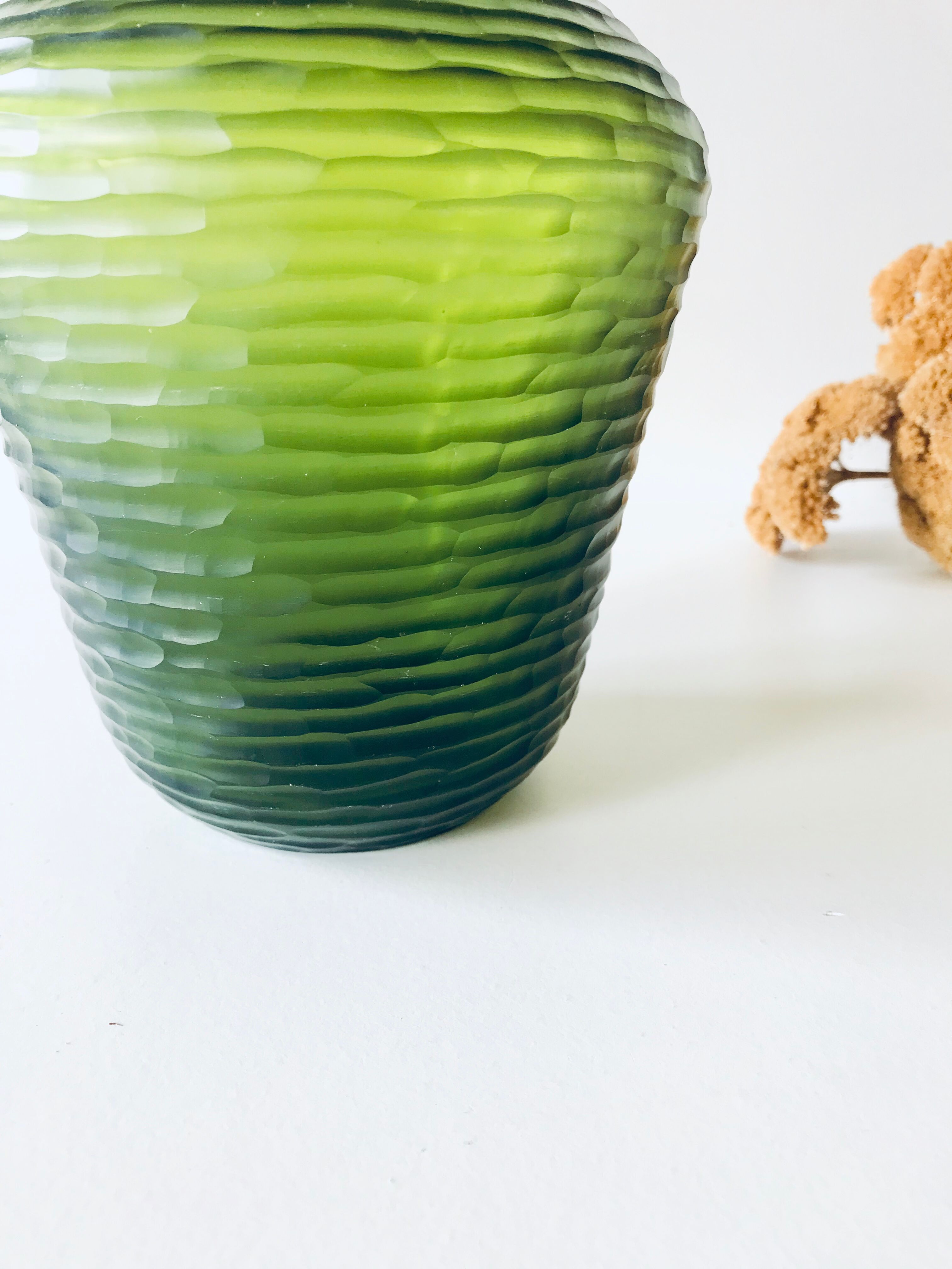 Green carved glass vase