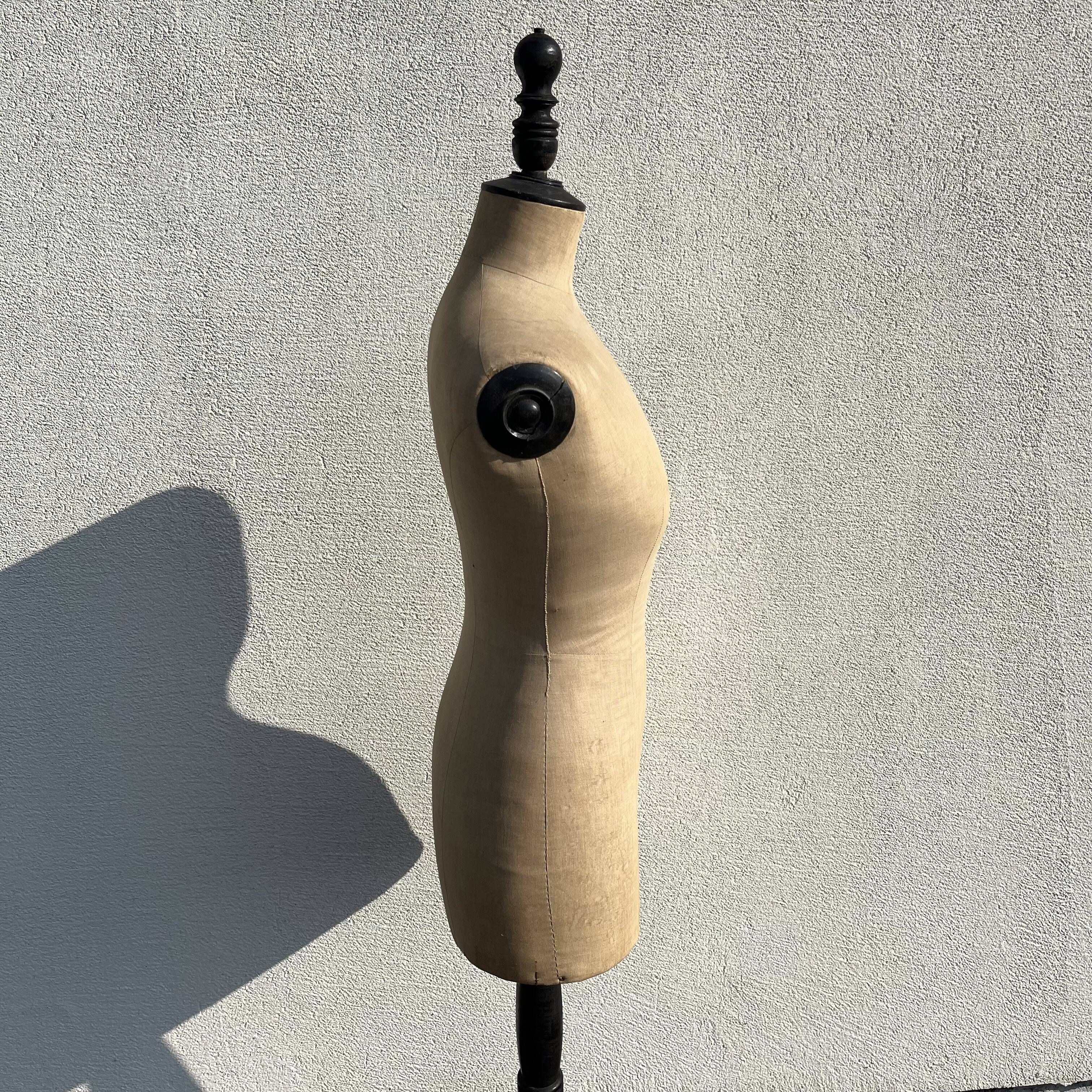 Antique mannequin in fabric and blackened wooden foot Stockman Paris Le Louvre