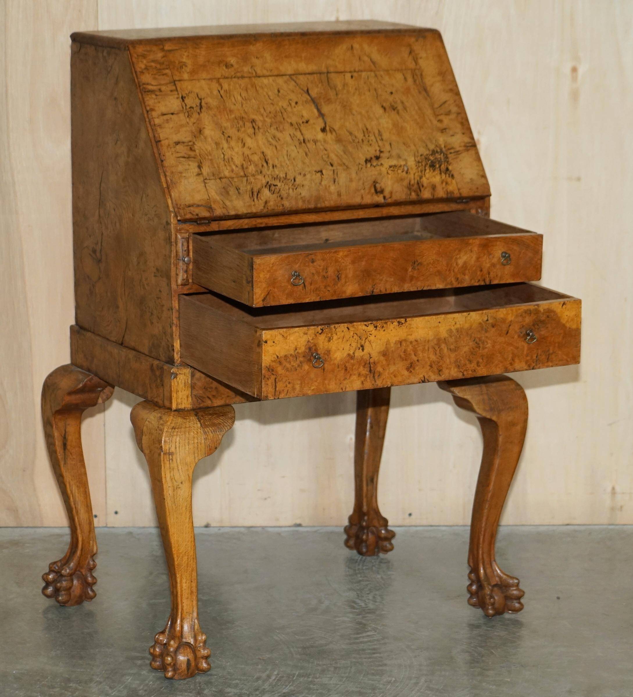 Writing desk in pollard oak from around 1800 with claw and ball carved legs.