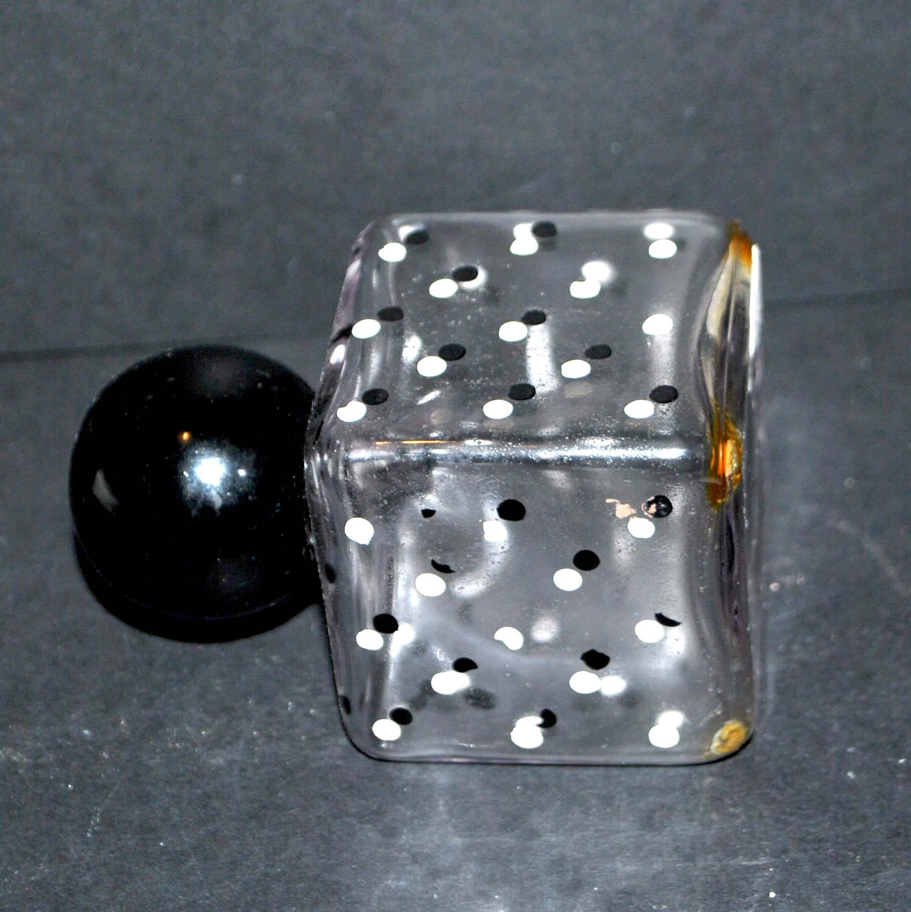 Vintage white and black polka dot glass perfume bottle and round bakelite cap