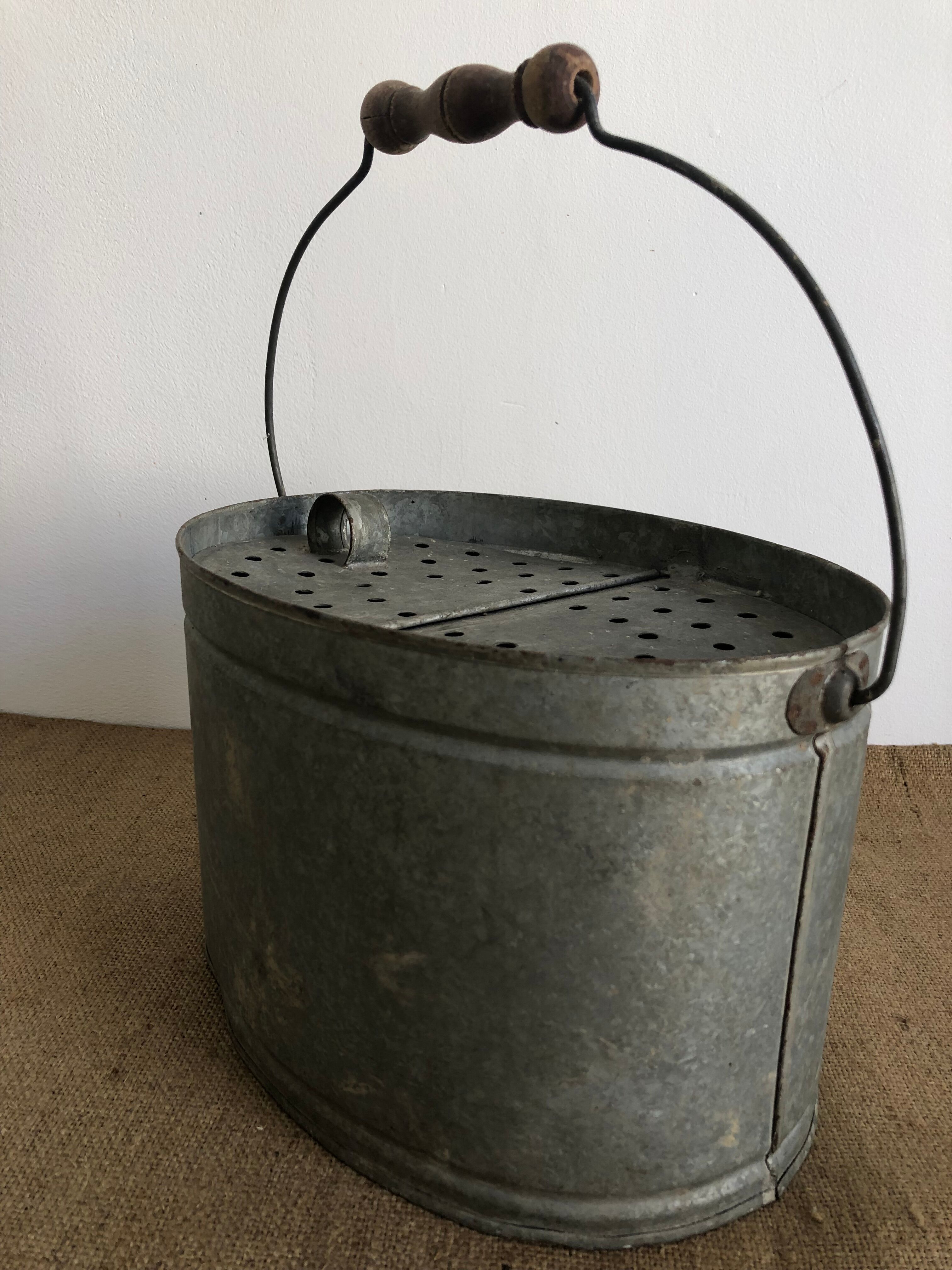 Old zinc stud, fisherman's live bucket