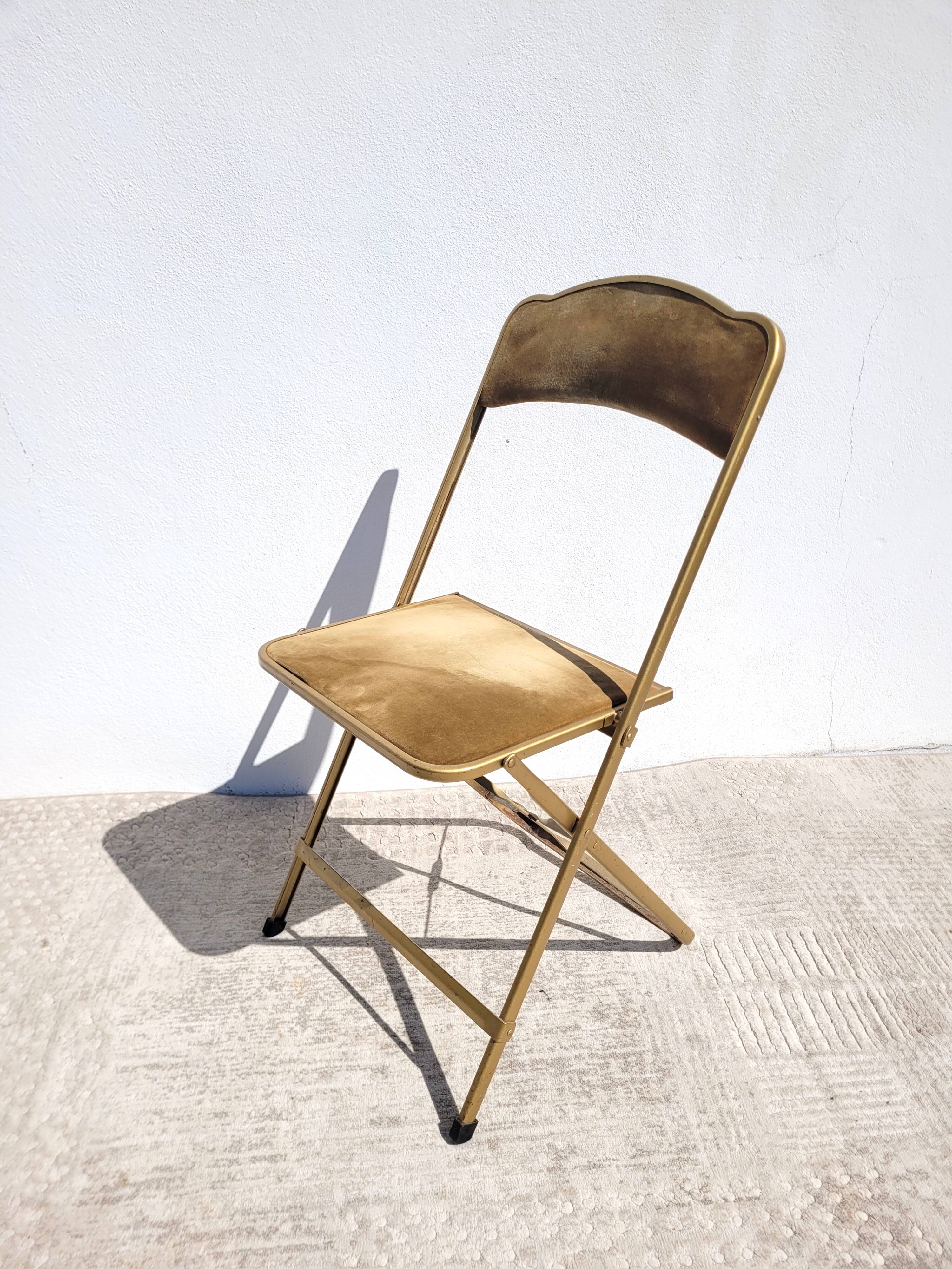 Golden folding opera chair