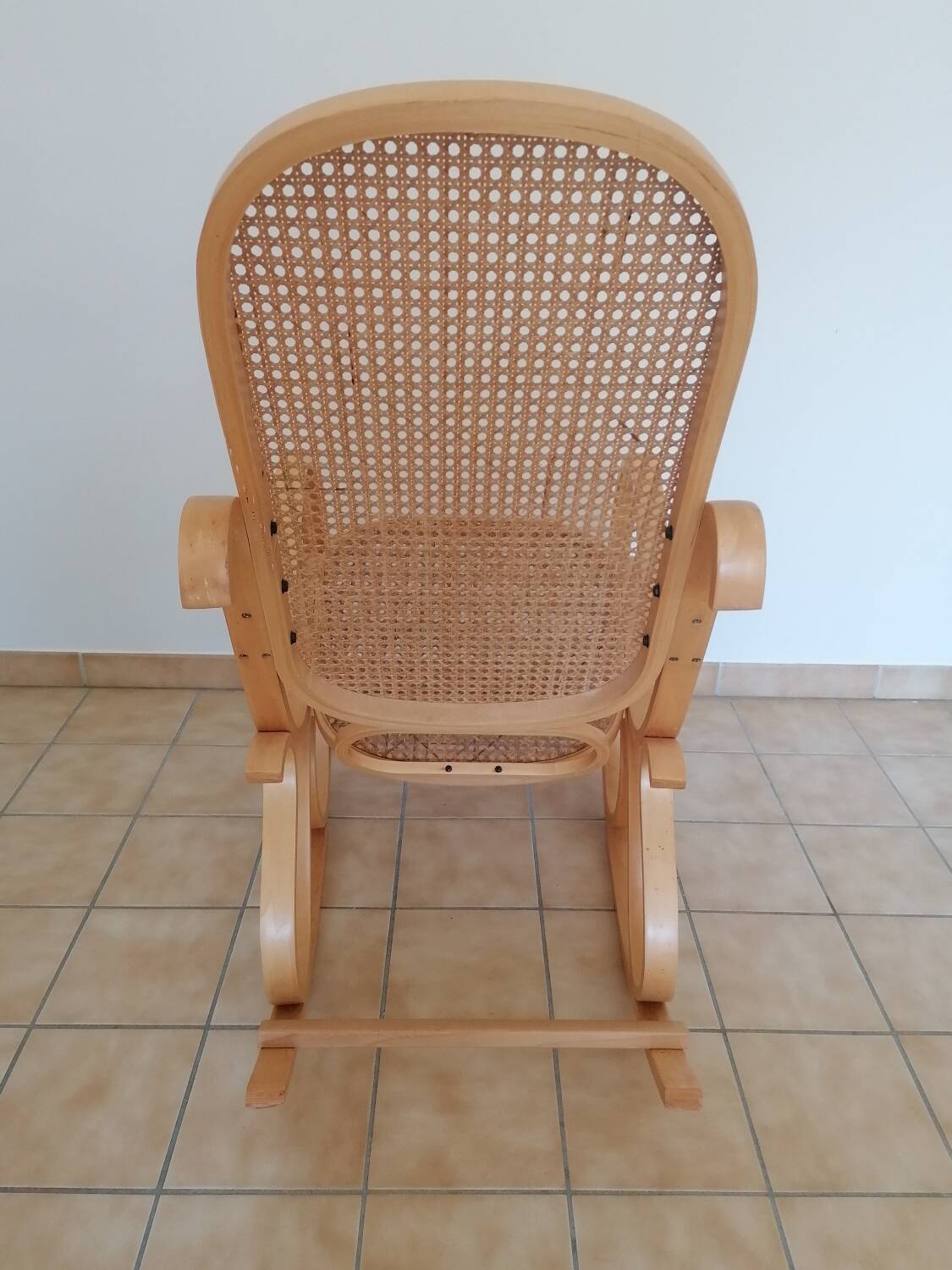 Wooden and cane rocking chair