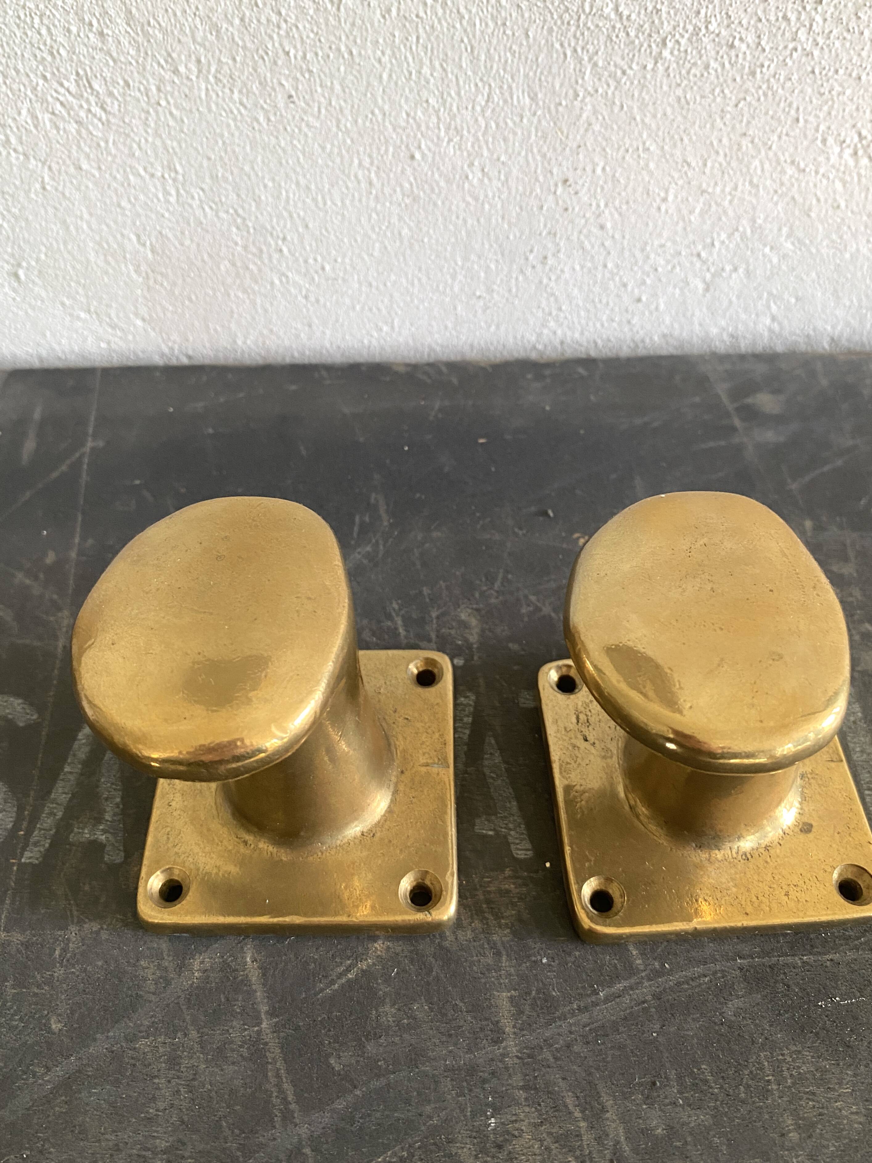 Pair of golden cast iron hooks