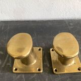 Pair of golden cast iron hooks