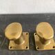 Pair of golden cast iron hooks