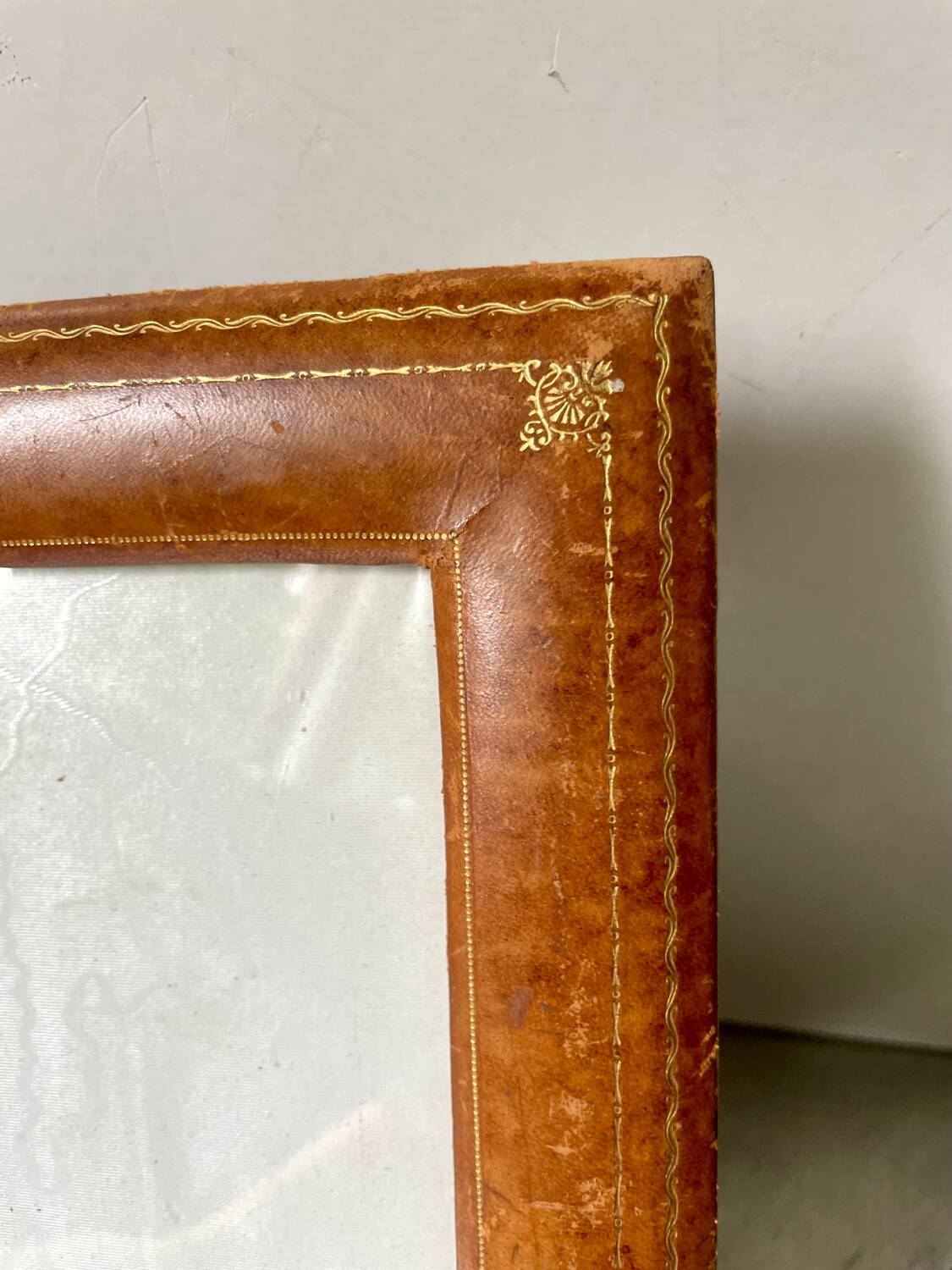 Antique  leather  with gilding frame measurements 31 cm x 25 cm