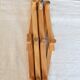 Vintage retractable wall-mounted coat rack made of pine wood