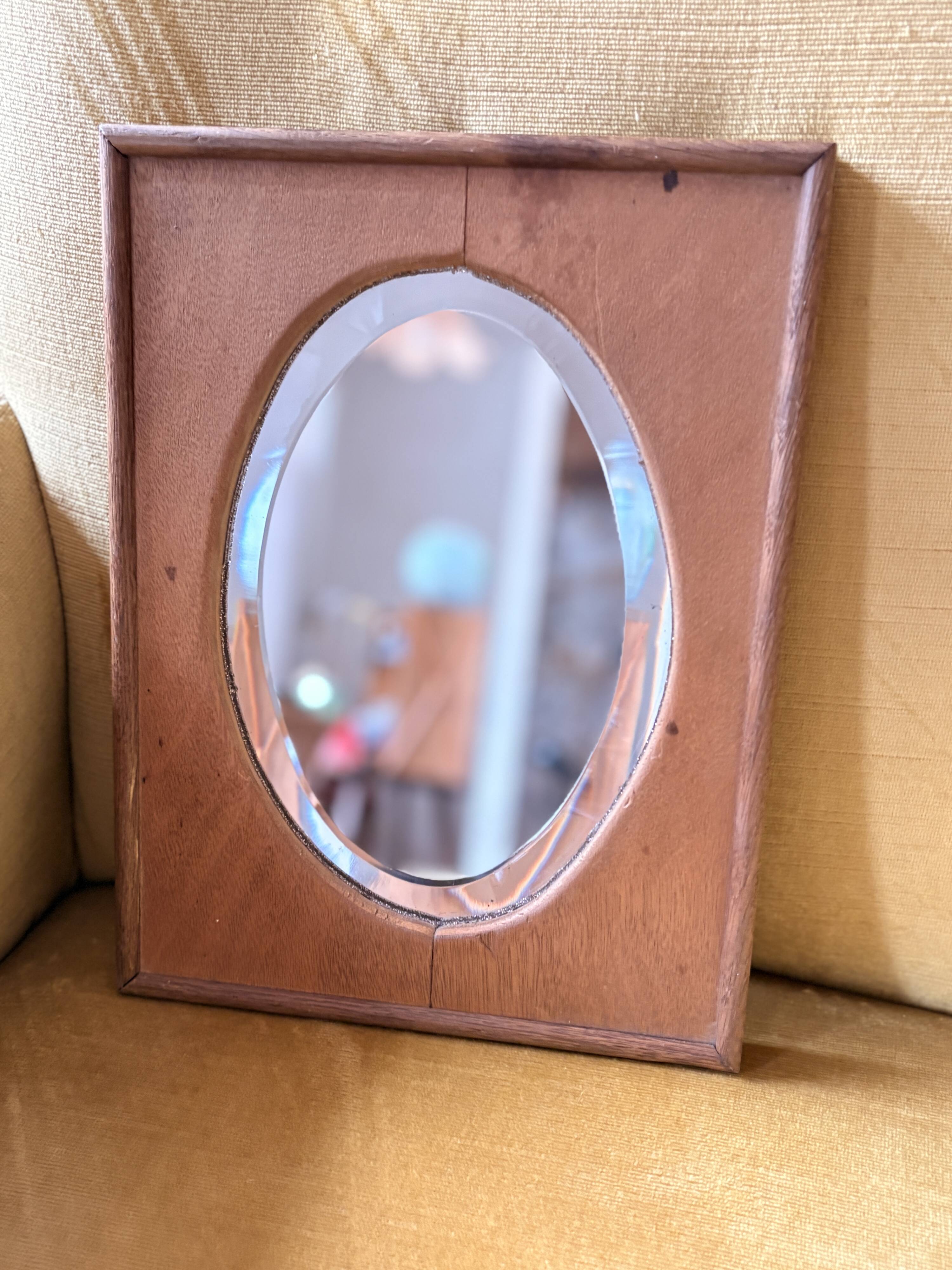 Bevelled oval mirror on oak frame