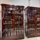 Pair of Empire period mahogany bookcases with flame pattern from the 19th century.