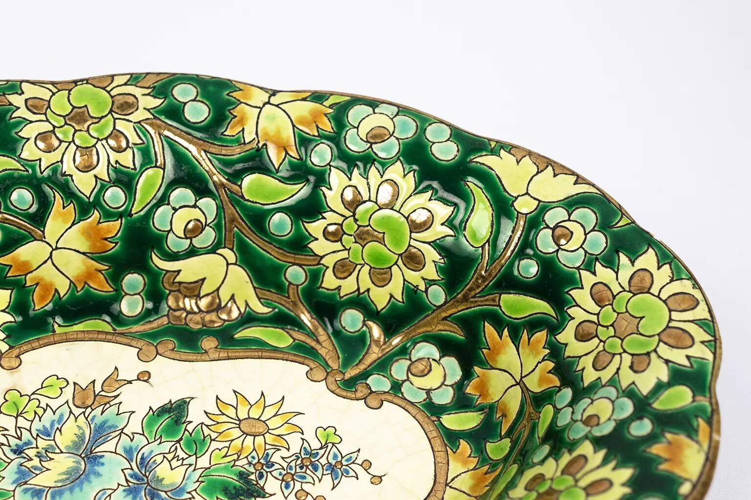 Longwy cup in cloisonné enamels on a green background, polychrome floral decoration and gold