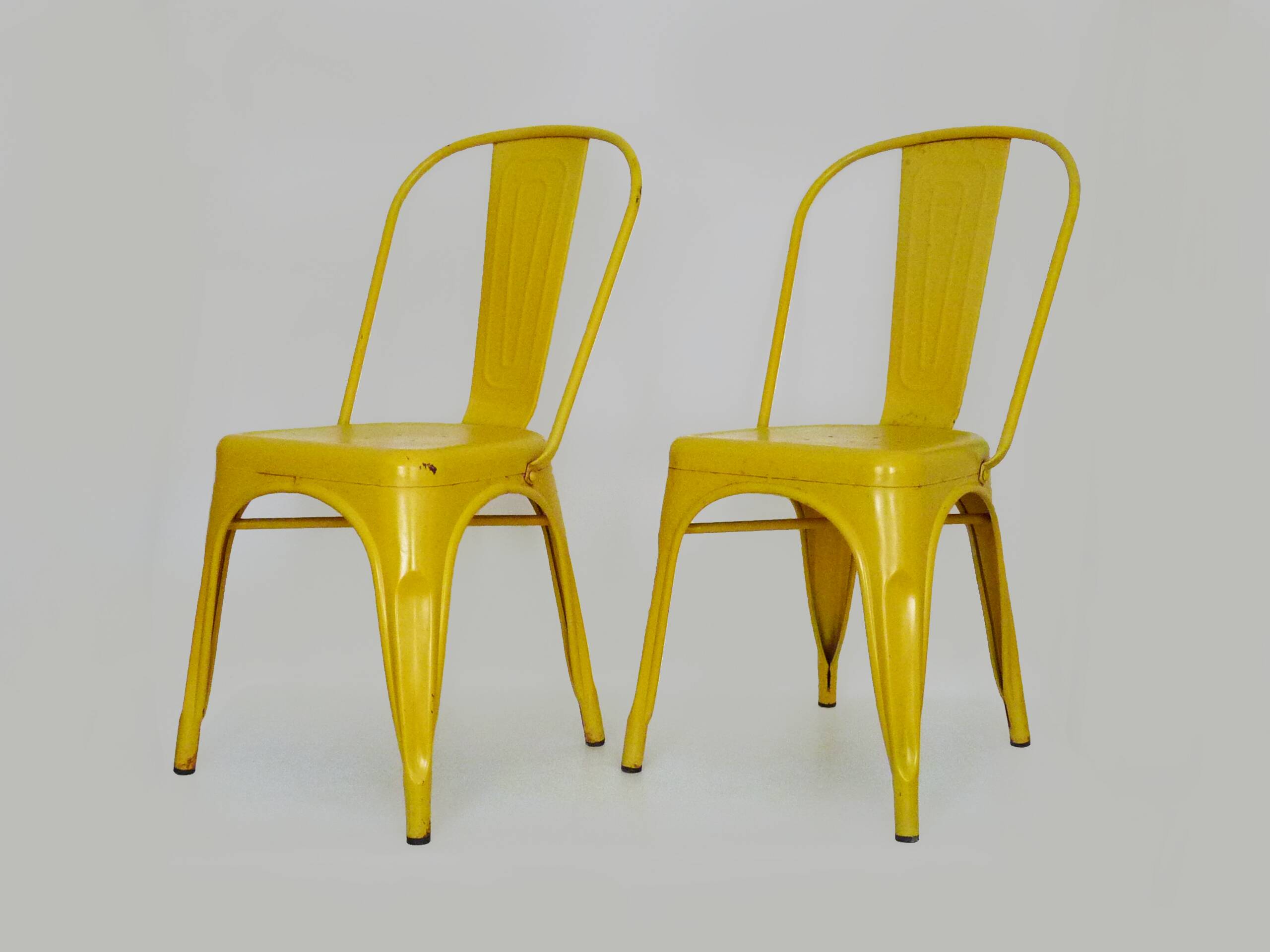 Pair of Tolix Chairs in yellow metal by Xavier Pauchard