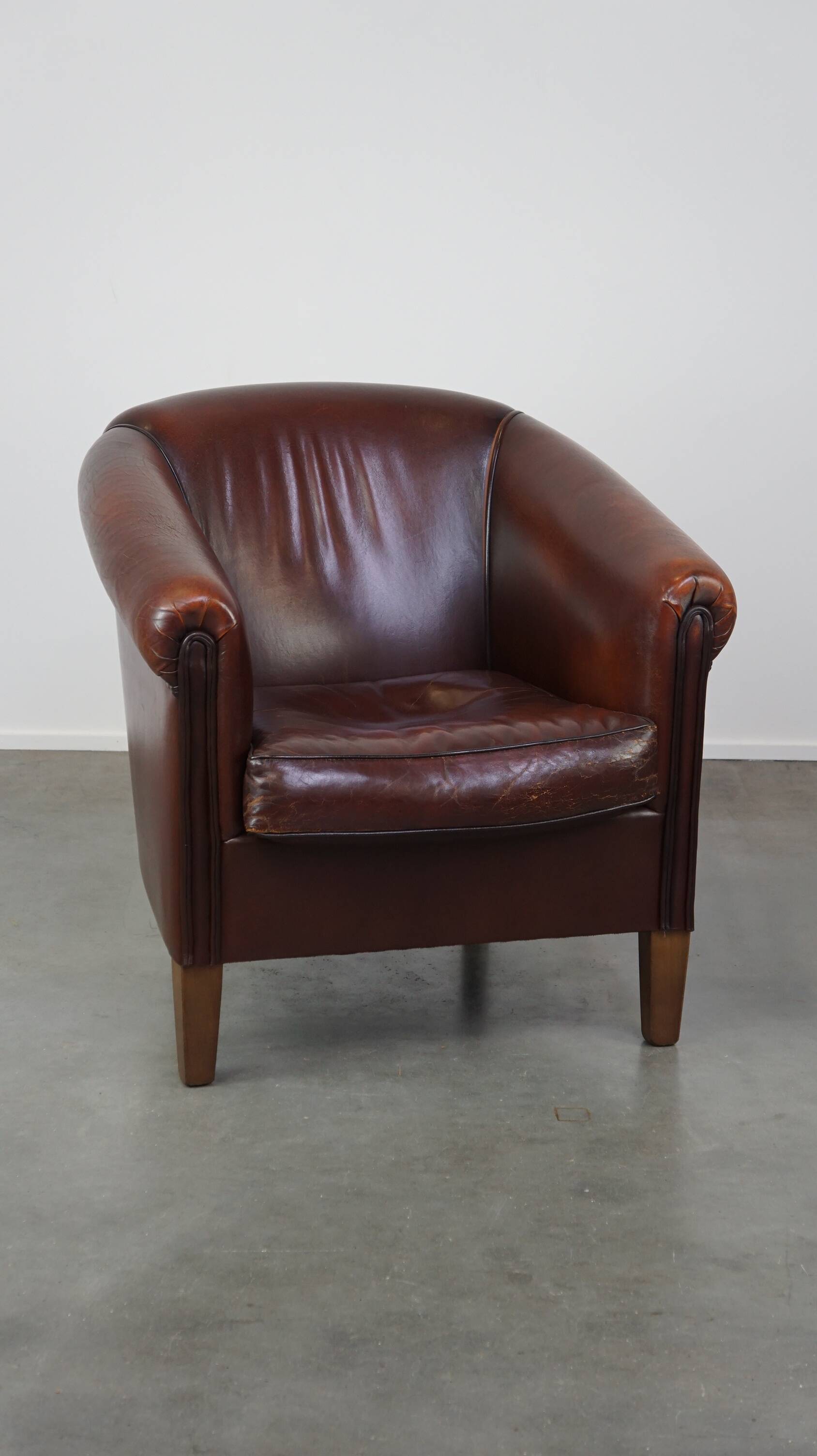 Nice sheepskin club chair with a beautiful patina