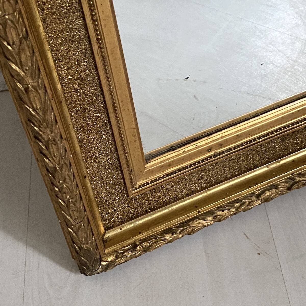 Small wooden mirror with gilded stucco in the Louis XVI style.