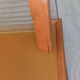 1950s coat rack with mirror, metal hooks, and glass shelf.