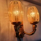 Golden bronze wall lamp with mermaids for an old bathroom.