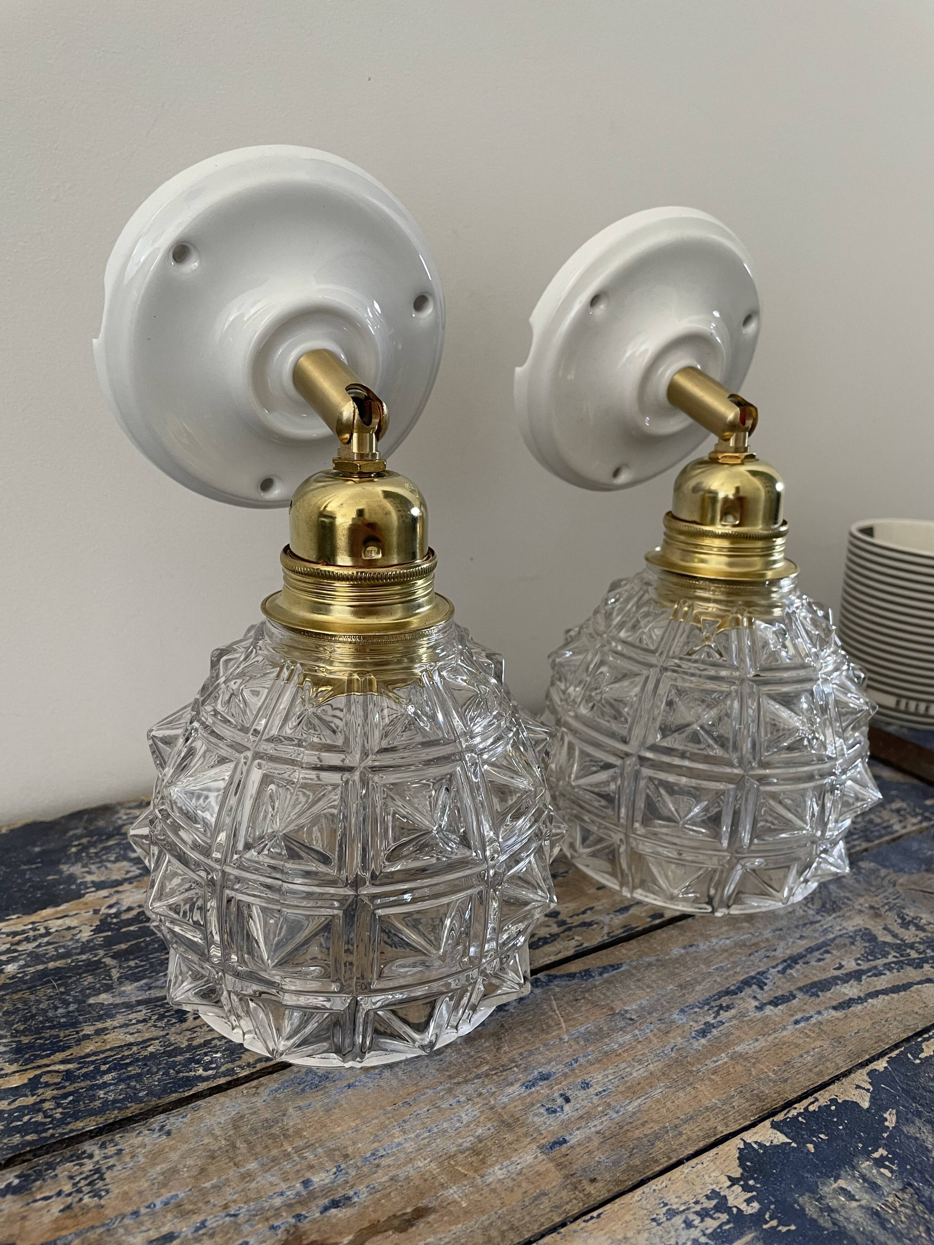 Pair of new electrified chiseled glass sconces