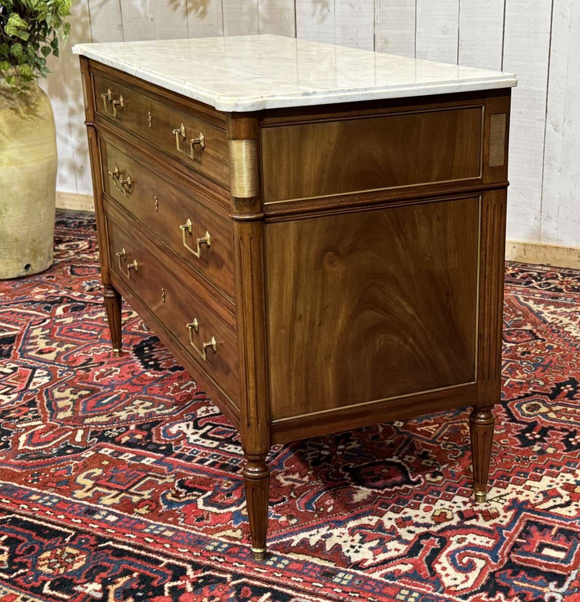 Louis XVI commode in mahogany with a marble top from the 1950s.