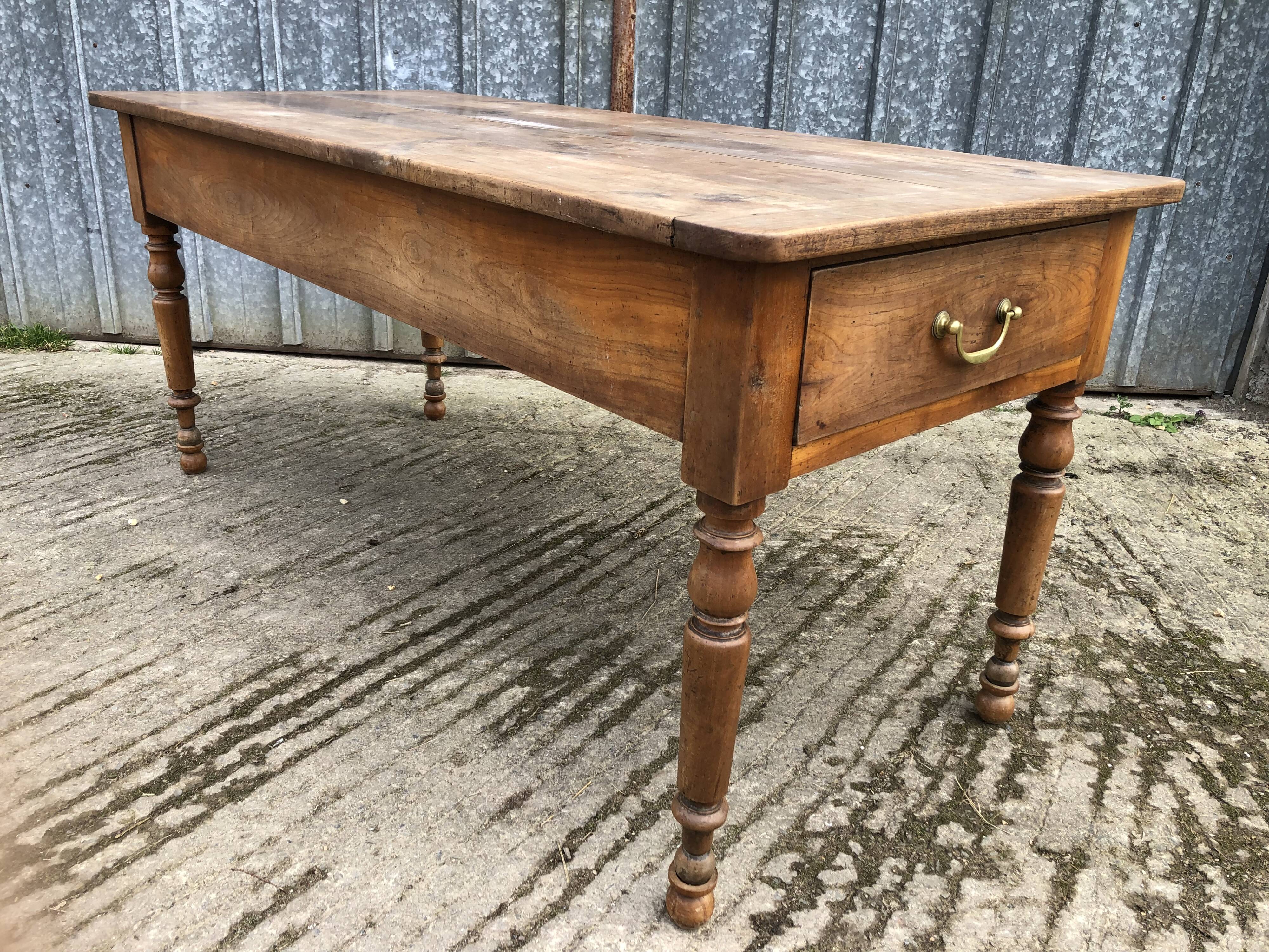 Antique cherry farmhouse table with 2 drawers and 1 pull-out