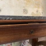 Console inlaid with black marble and lion's paw legs.