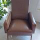 a pair of comfortable vintage armchairs with splayed legs
