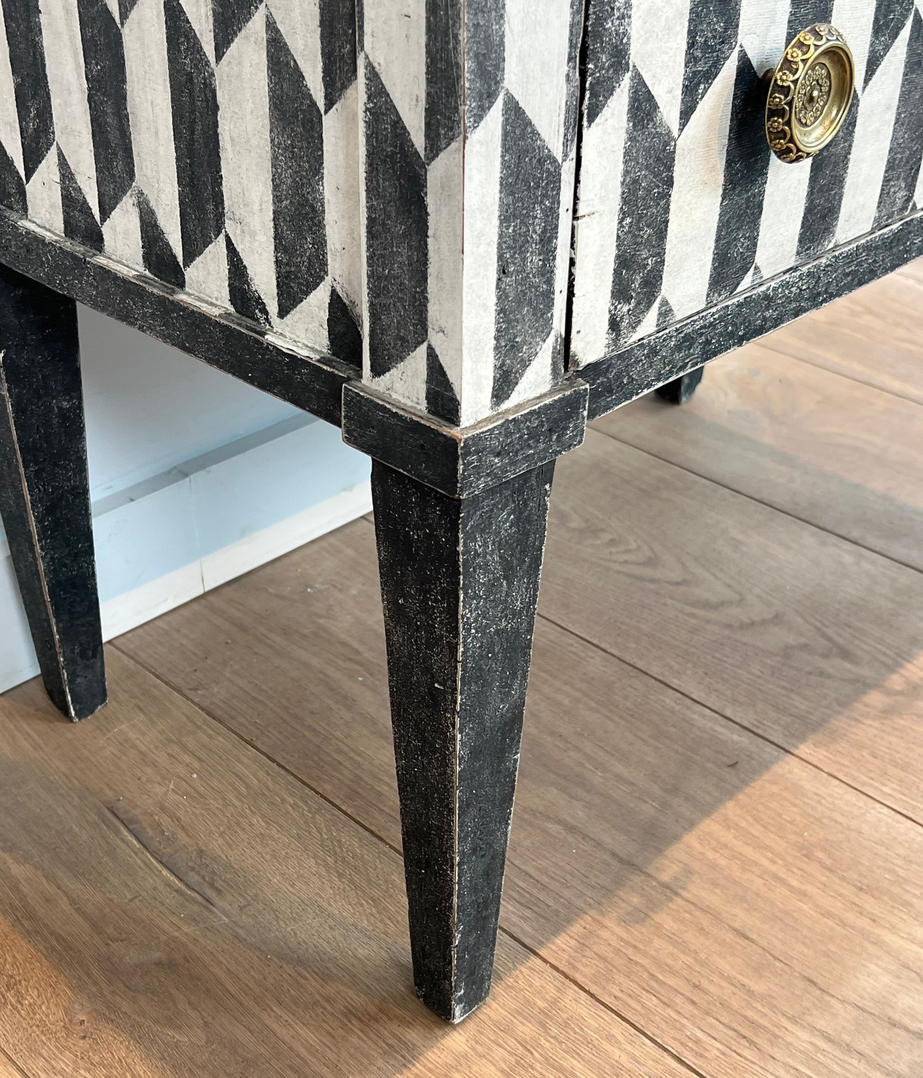 Small Italian chest of drawers with two drawers, patinated with a trompe-l'œil checkerboard pattern