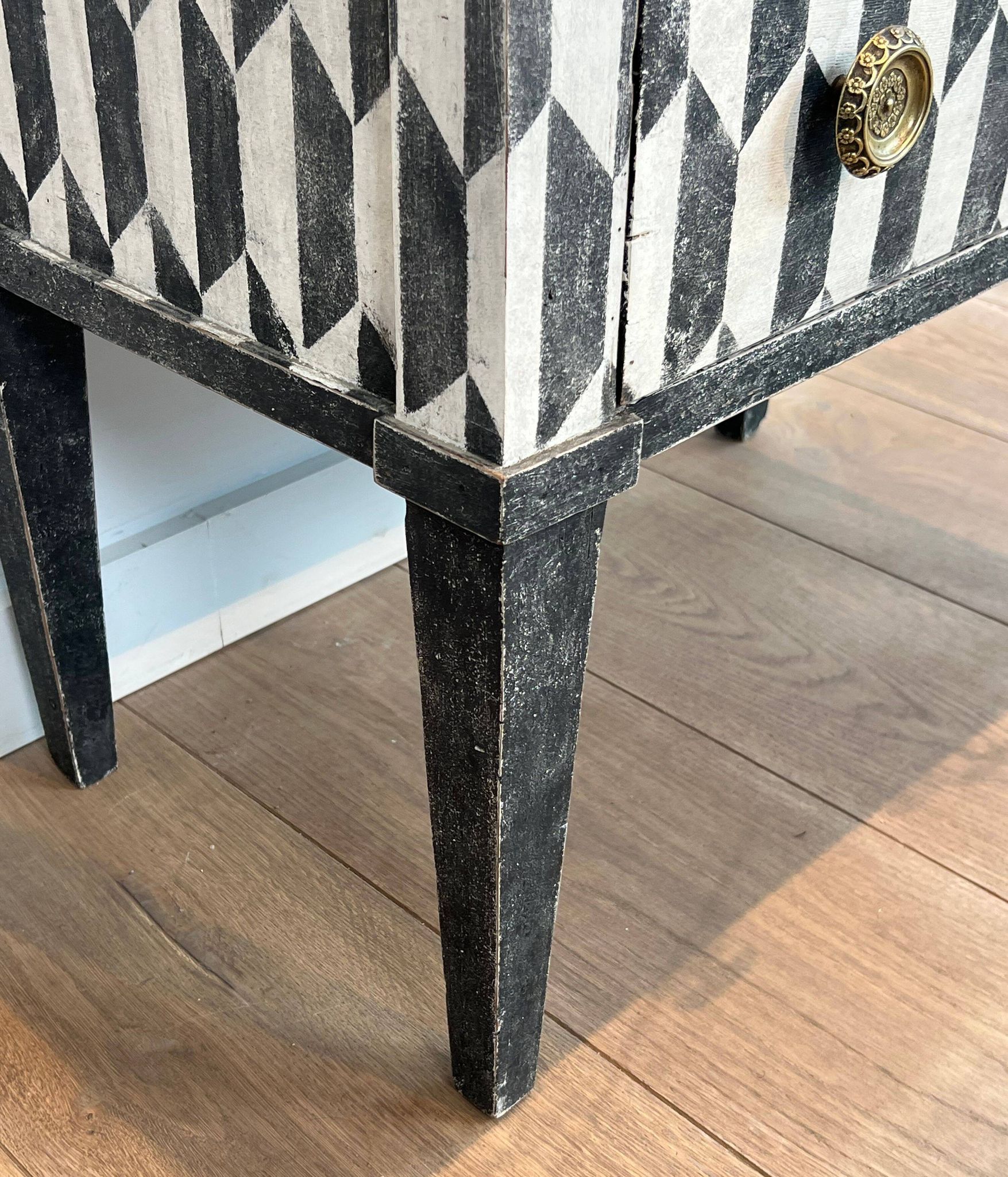 Small Italian chest of drawers with two drawers, patinated with a trompe-l'œil checkerboard pattern