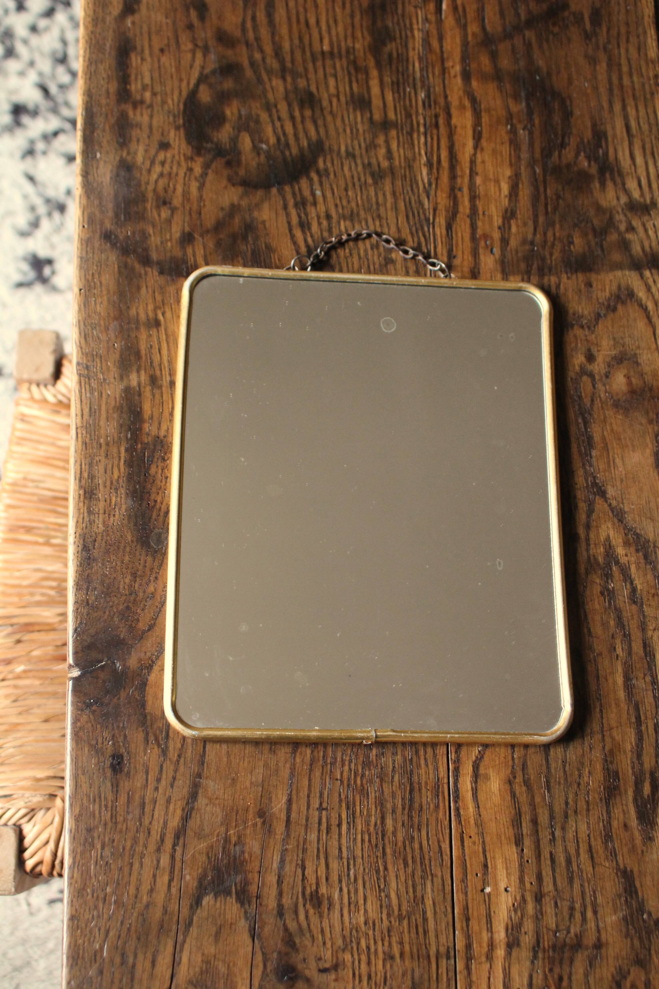 Simple barber mirror with gold metal chain