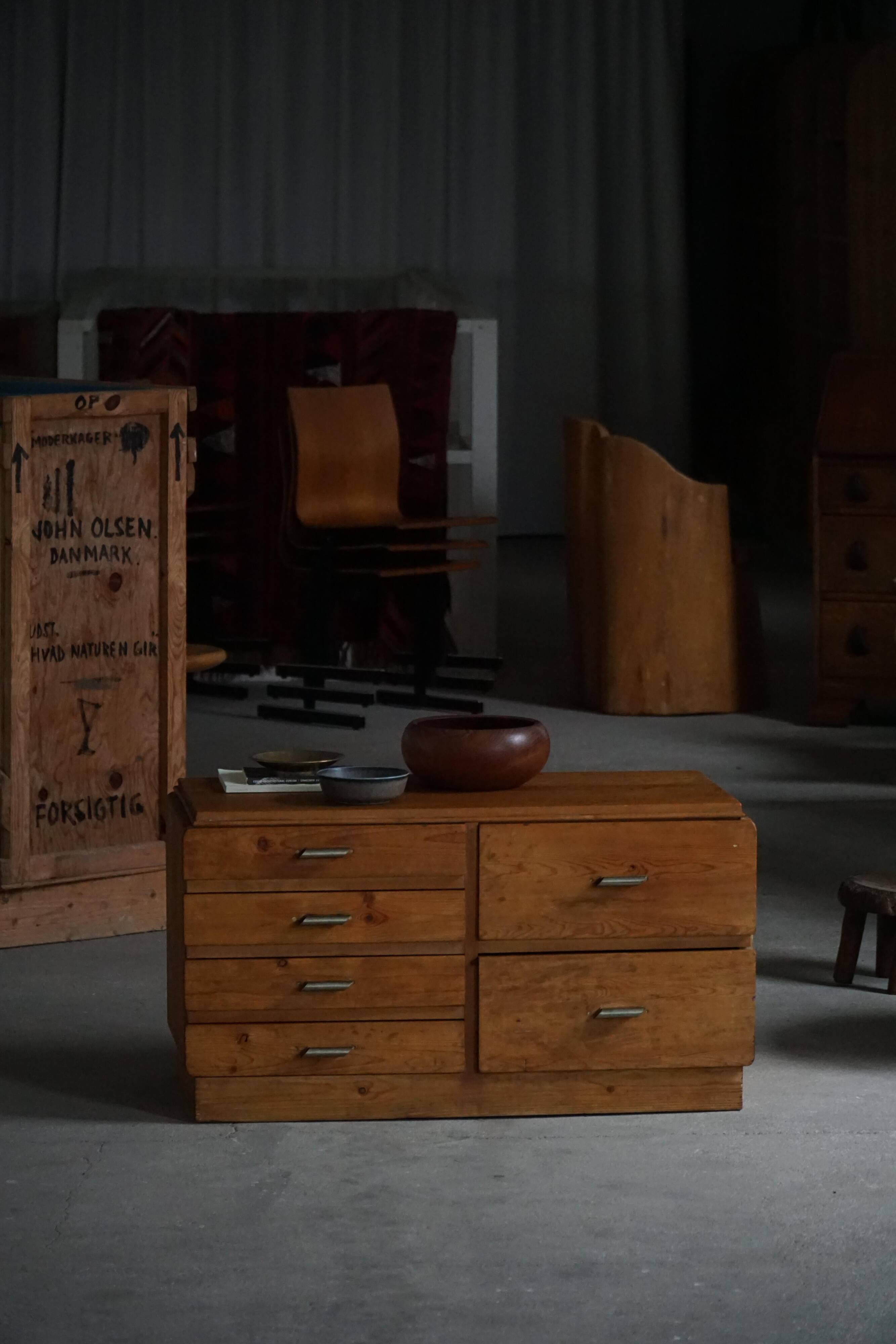 Mid-20th century Art Deco chest of drawers in pine with metal handles, 1940s.