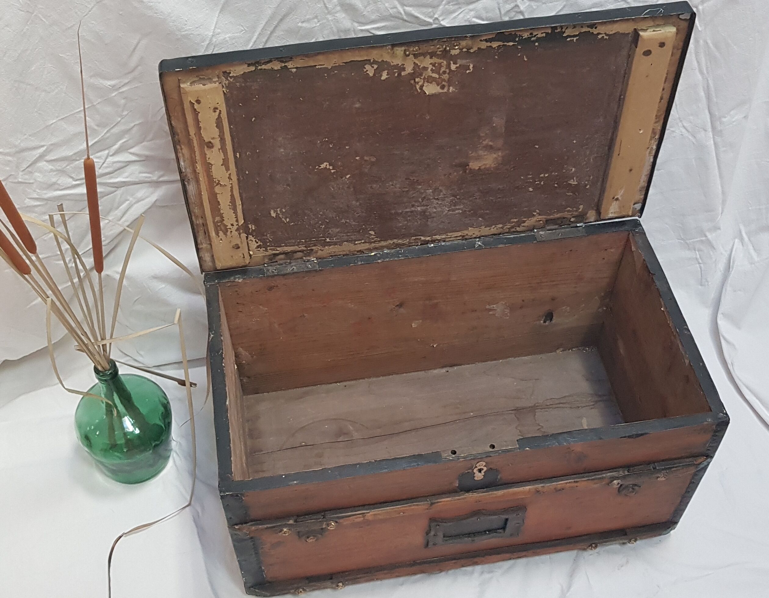 Former wooden travel trunk