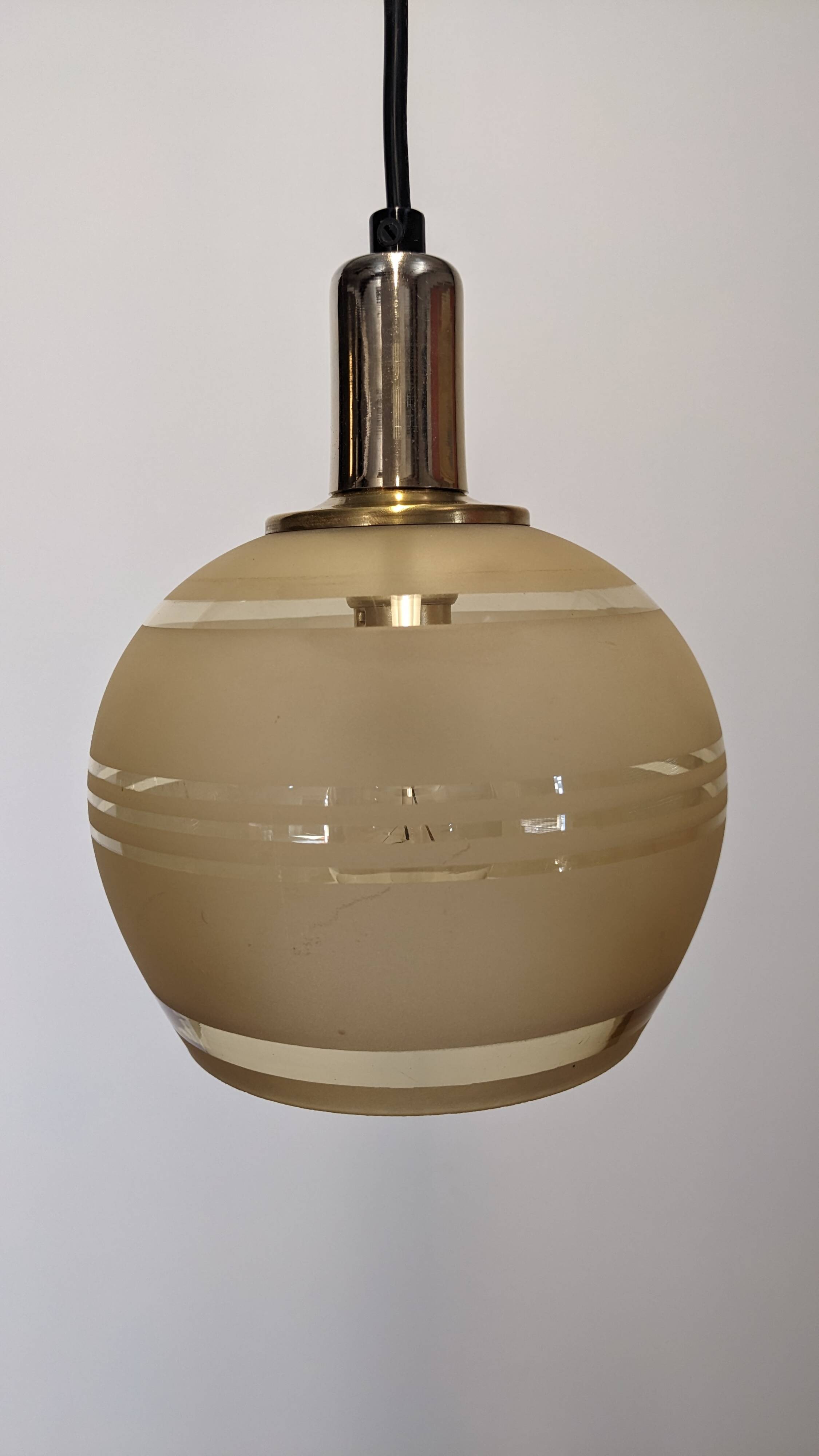 Art Deco style ball pendant light in gold glass