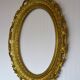 Oval frame in golden resin