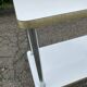 White and gold serving trolley in steel and wood