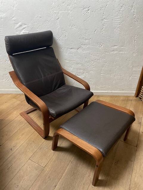 Leather armchair with footrest