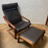 Leather armchair with footrest
