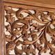 Very large freestanding teak mirror with an openwork carved pediment, Indonesia.