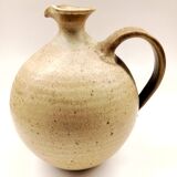 Vintage speckled brown stoneware pitcher in the shape of a ball