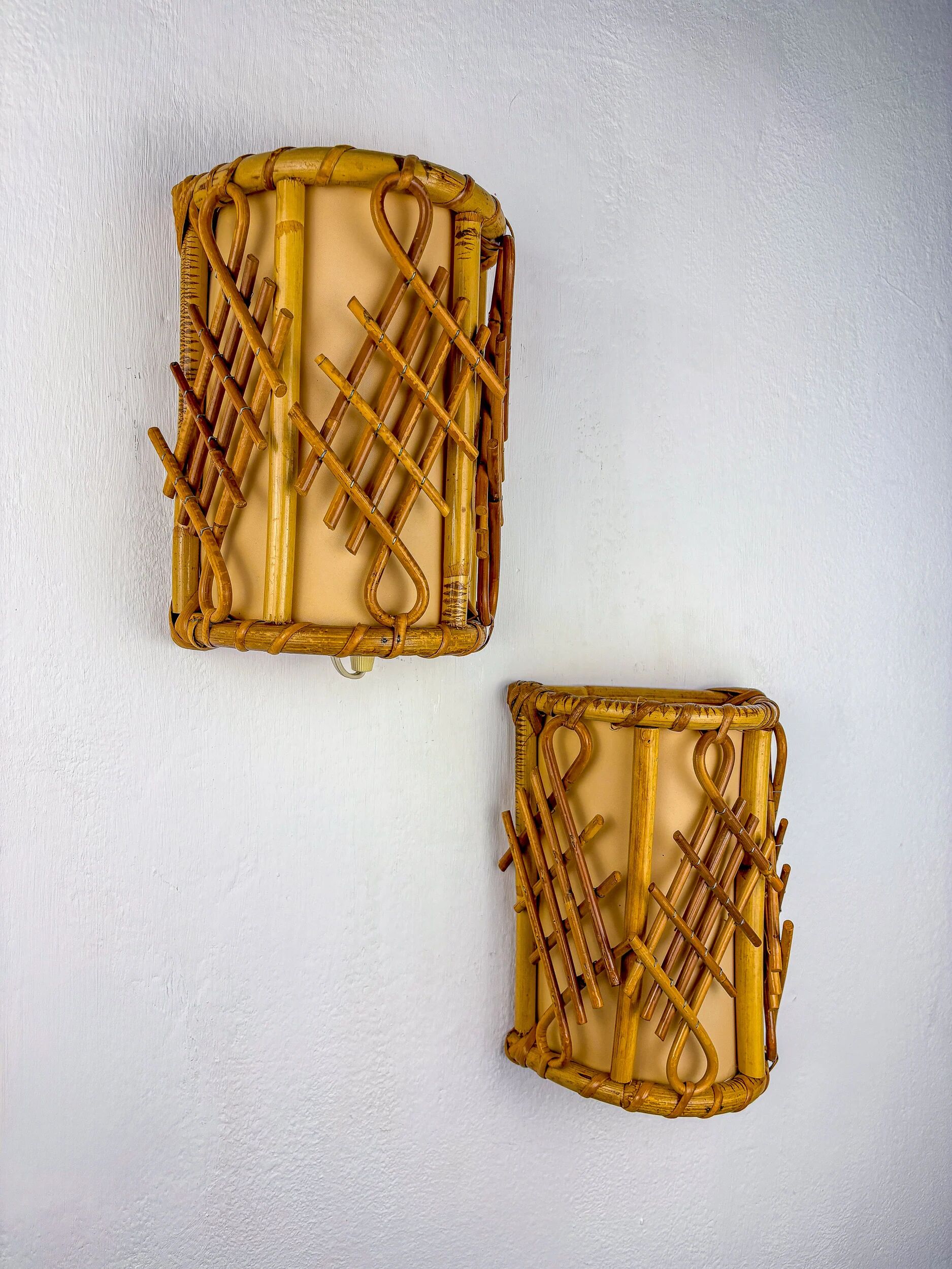 Pair of mid-century rattan wall sconces, circa 1970s, Italy