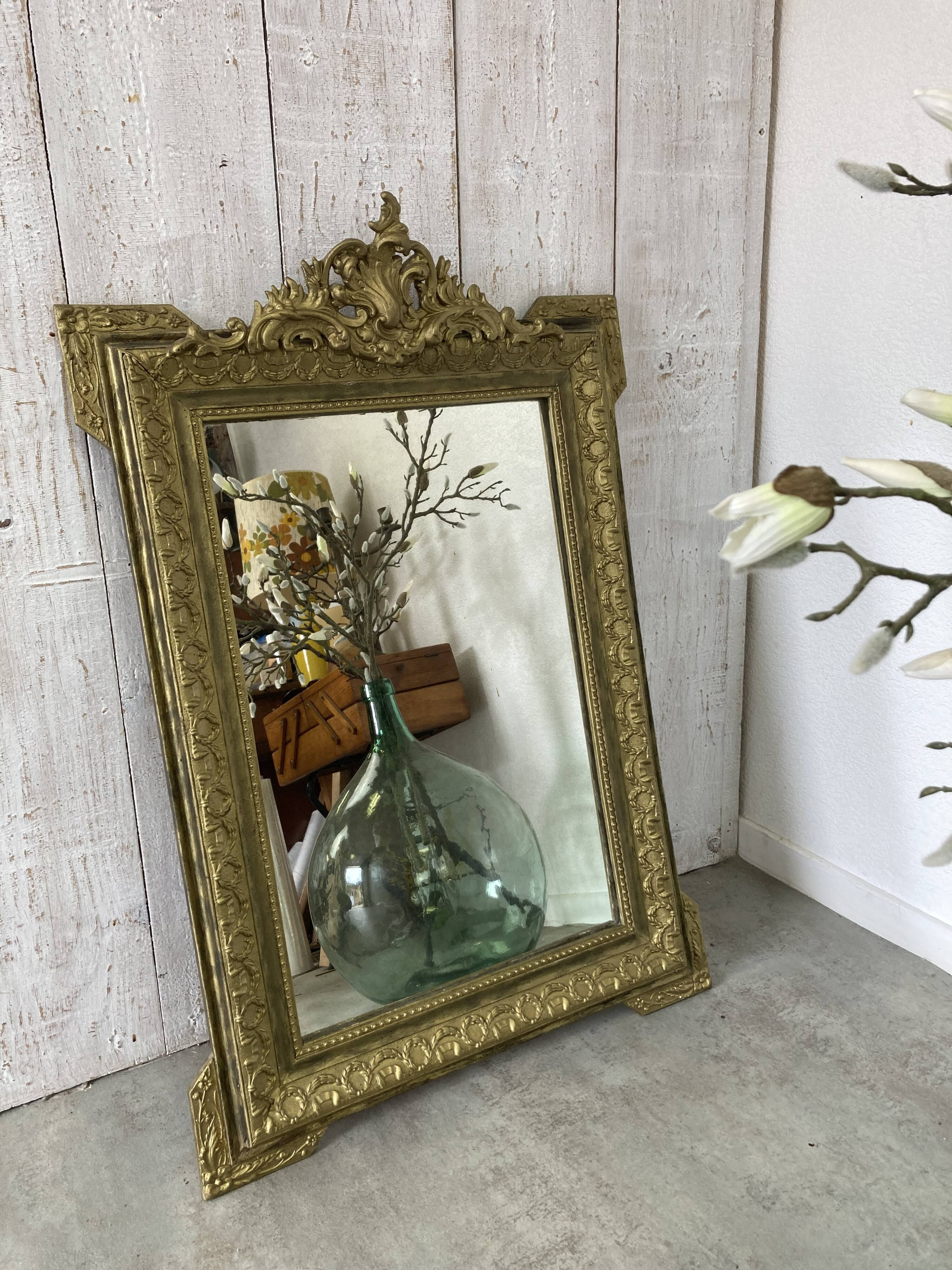 Antique mirror with a pediment