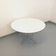 Vintage Eames round table for Vitra in white melamine, wood, and metal.