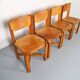Set of 4 dining chairs in elm wood and cognac leather.