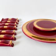 set of trivets, bottle coasters and knife holders in art de cherry-colored ceramic