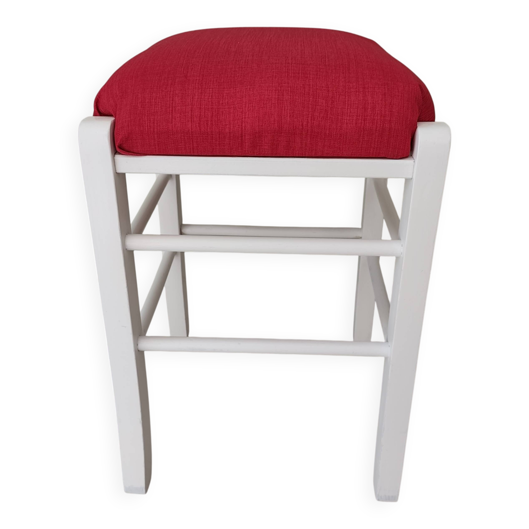 White pine stool with a red seat.