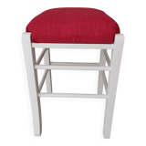 White pine stool with a red seat.