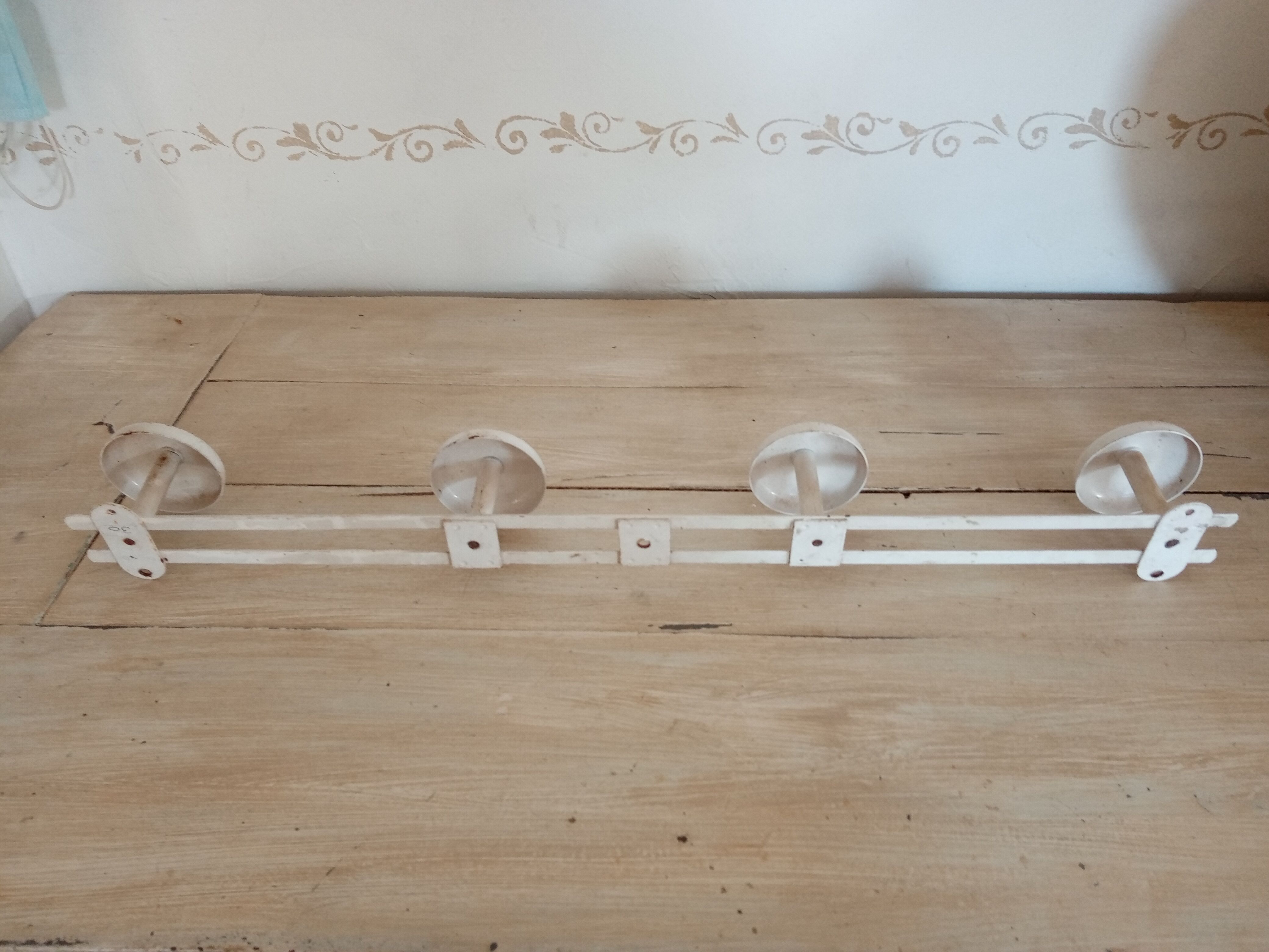 Metal wall coat holder
