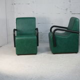 Pair of armrest heaters. Steel and green imitation leather. France, circa 1980